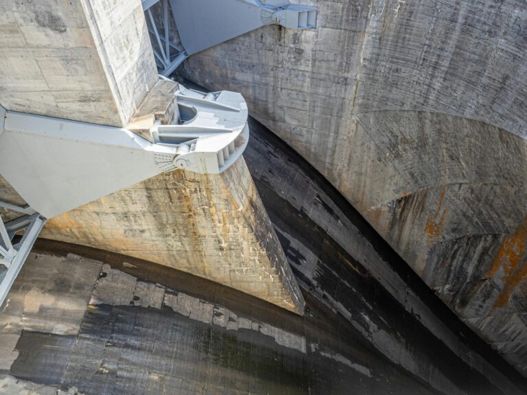 Detailed shot of a massive concrete dam showcasing industrial design and architecture.